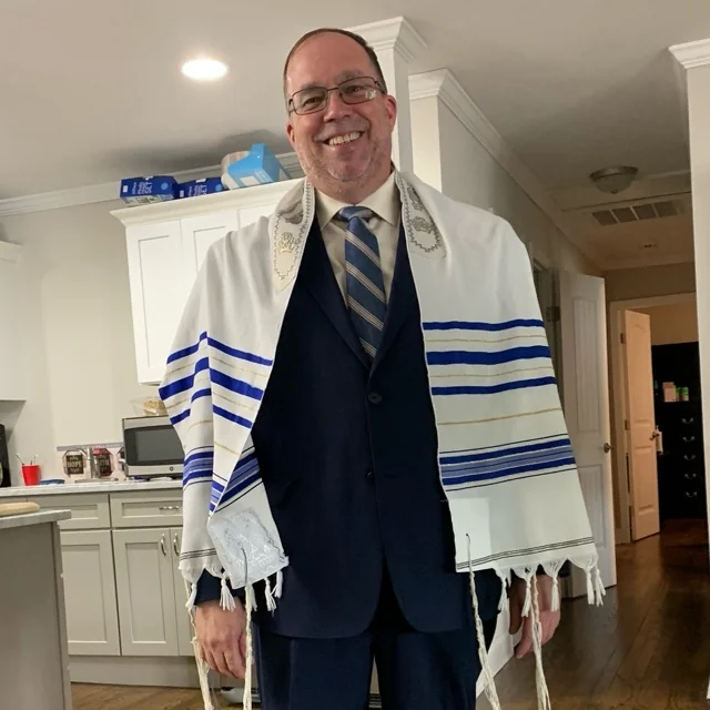 Bob at GraceHouse Transitional Ministries in 2019, wearing traditional prayer shawl and sharing wisdom while helping others rebuild their lives